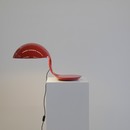 Red COBRA table lamp designed by Elio MARTINELLI